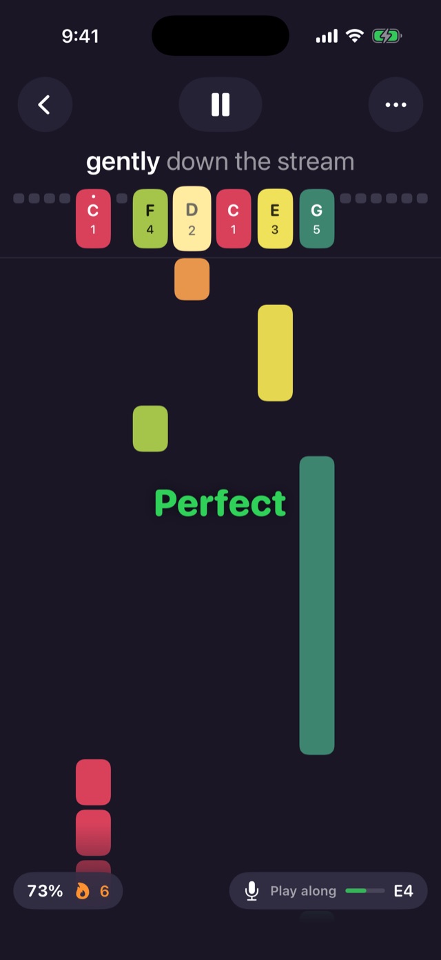 Playing along to Row, Row, Row Your Boat: notes fall toward colored tines, a green Perfect pop-up, 73% accuracy and a six-note streak